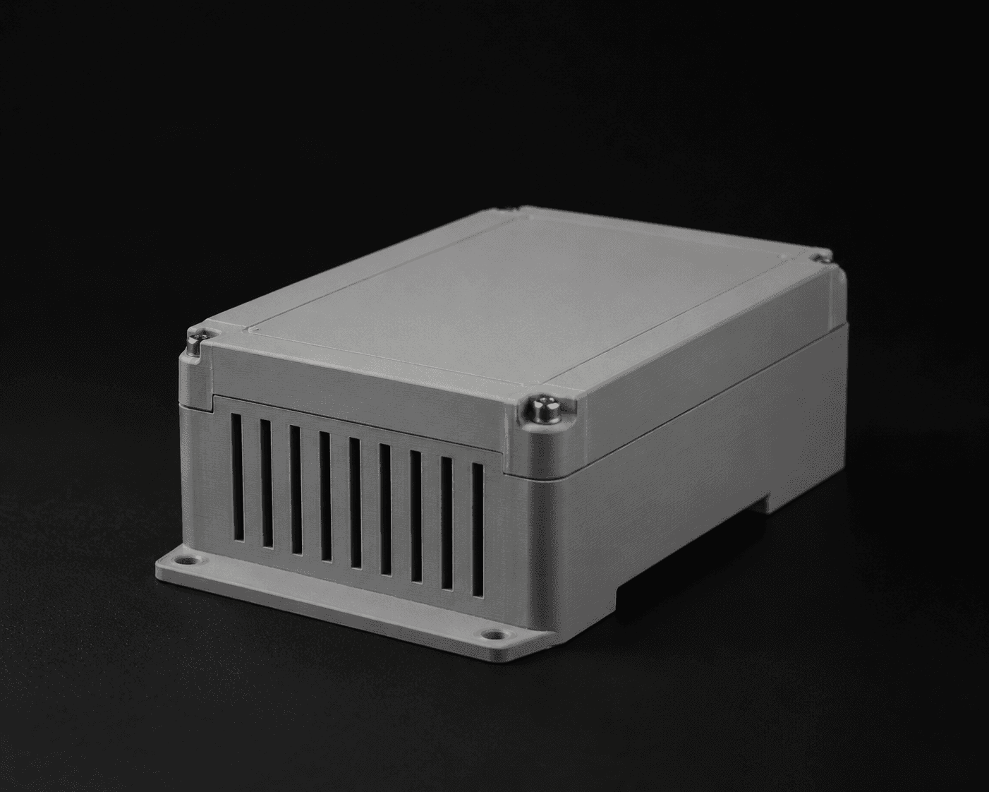 A precision 3D printed industrial enclosure photographed on a dark background.